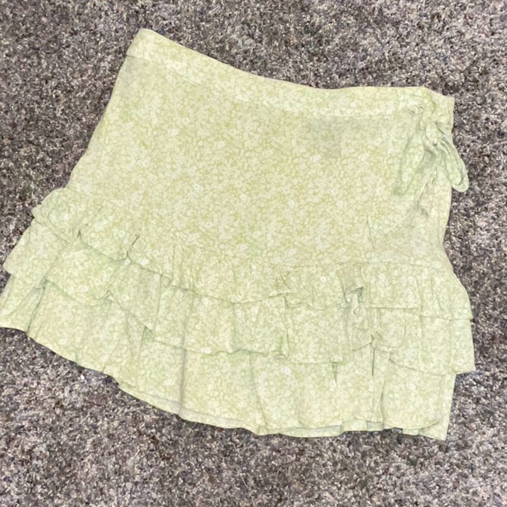 Flowy green skirt with white flower pattern